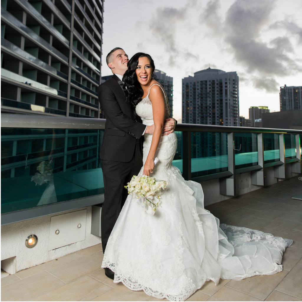 bride and groom laugh on the jw marriott marquis miami pool deck