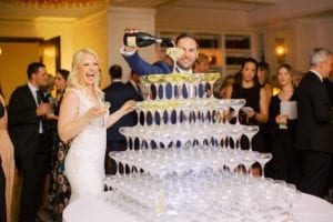 groom pouring champagne tower at confidante miami beach