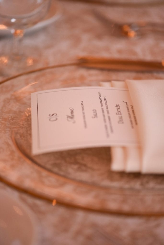 The gold rim chargers from Nuage Designs looked amazing on top of the Mardi Gras Parchment linen