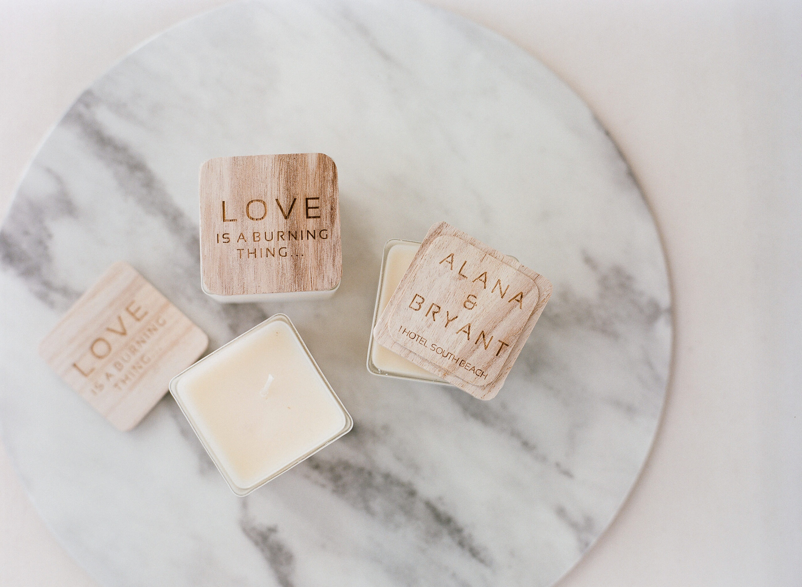 The personalized candle wedding favors from Taja Collection were engraved with the Ring of Fire lyrics