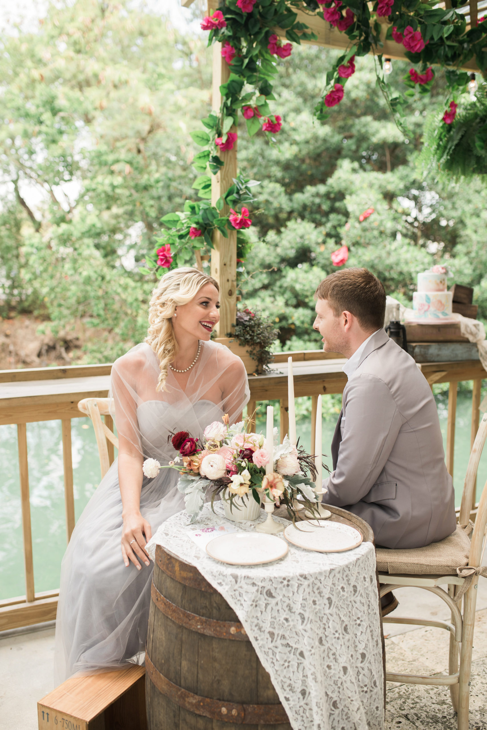 y and the Tramp wedding seating featured wooden barrels and boxes, softened by lace and florals