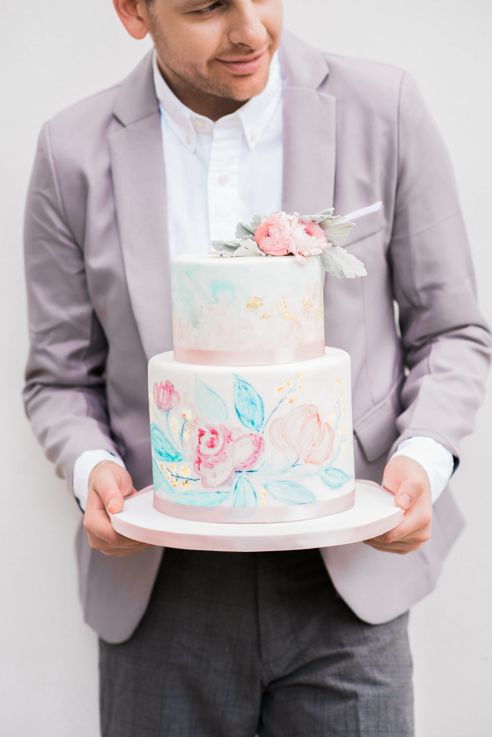 The Lady and the Tramp wedding included watercolor hand painted wedding cake that mirrored the watercolor invitations and colors as well