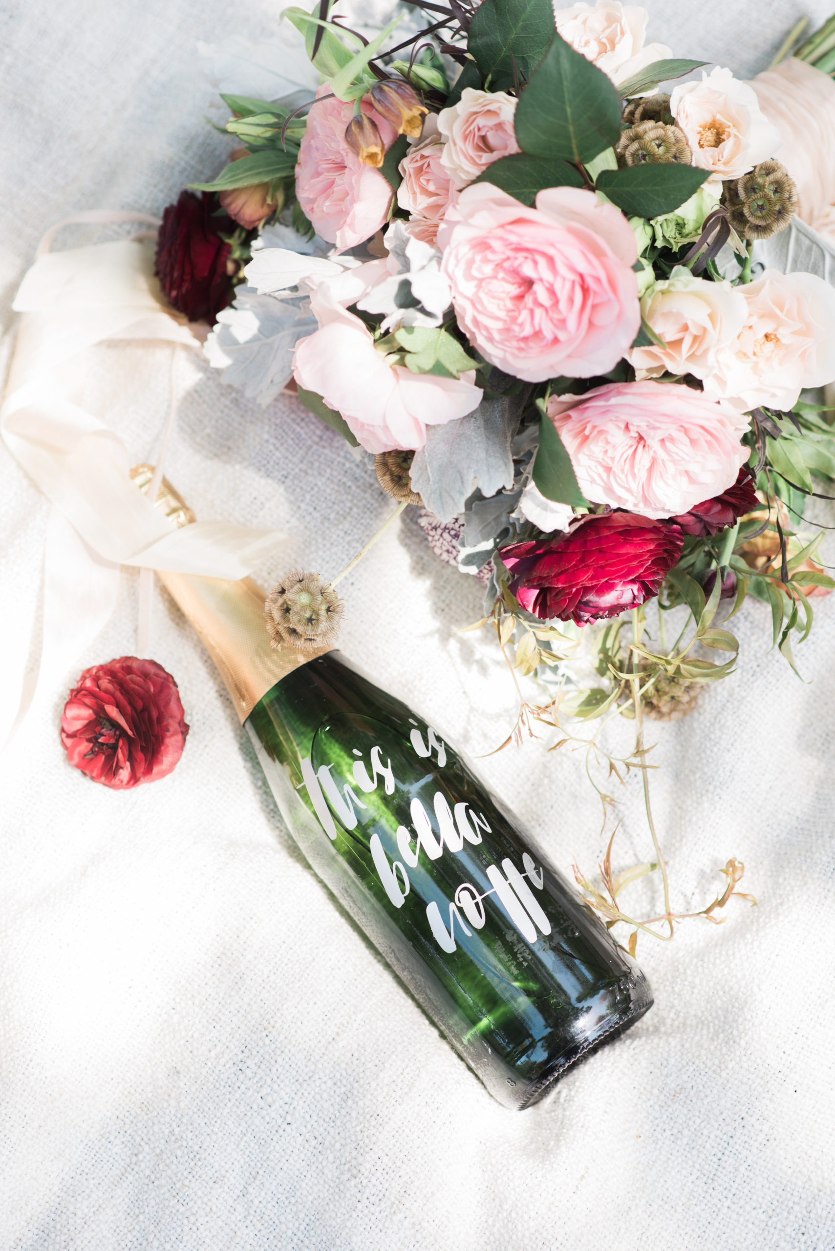 The Lady and the Tramp wedding included a custom champagne bottle with Bella Notte in vinyl