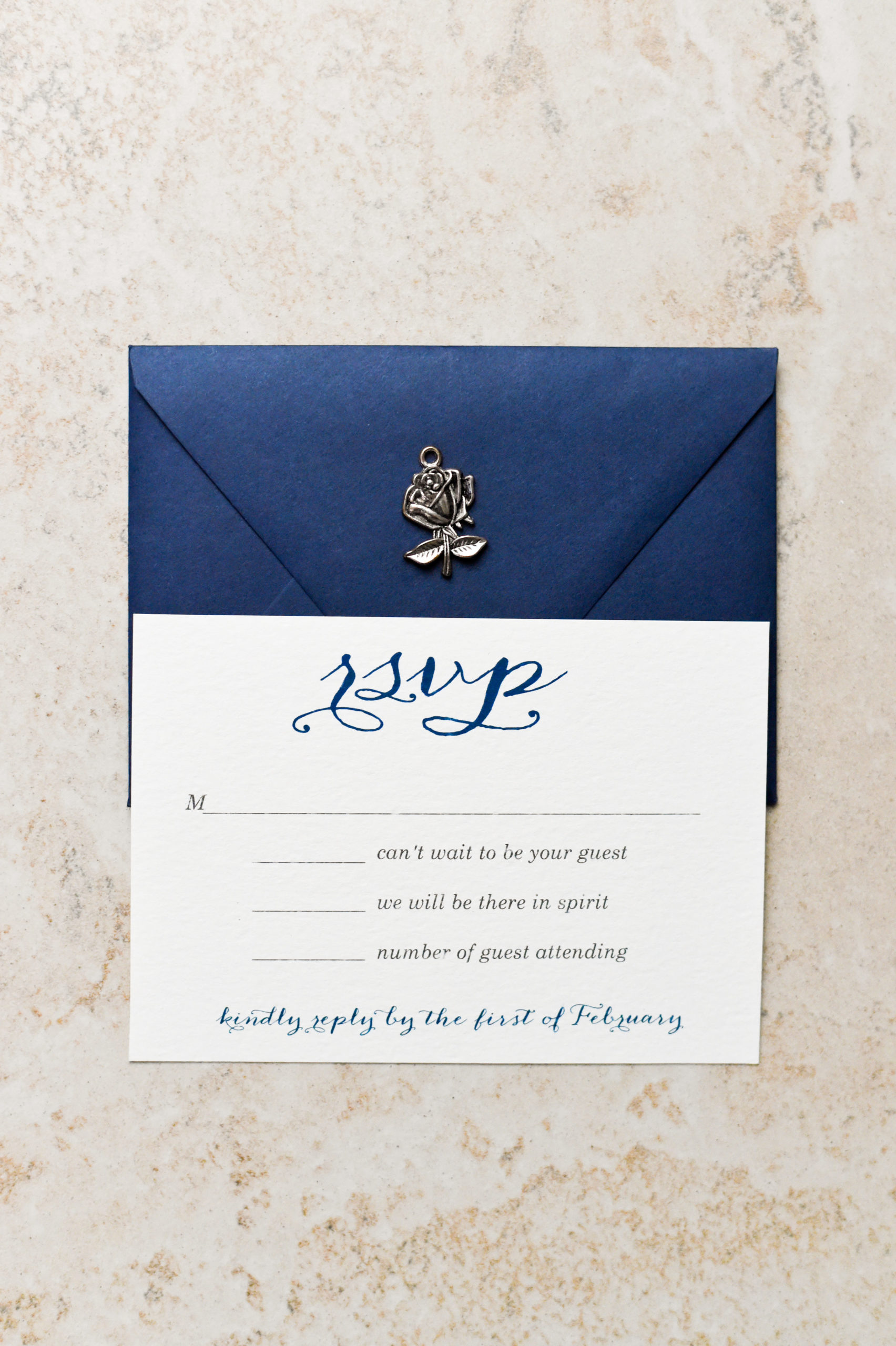 The perfect navy and script Beauty and the Beast wedding invitation