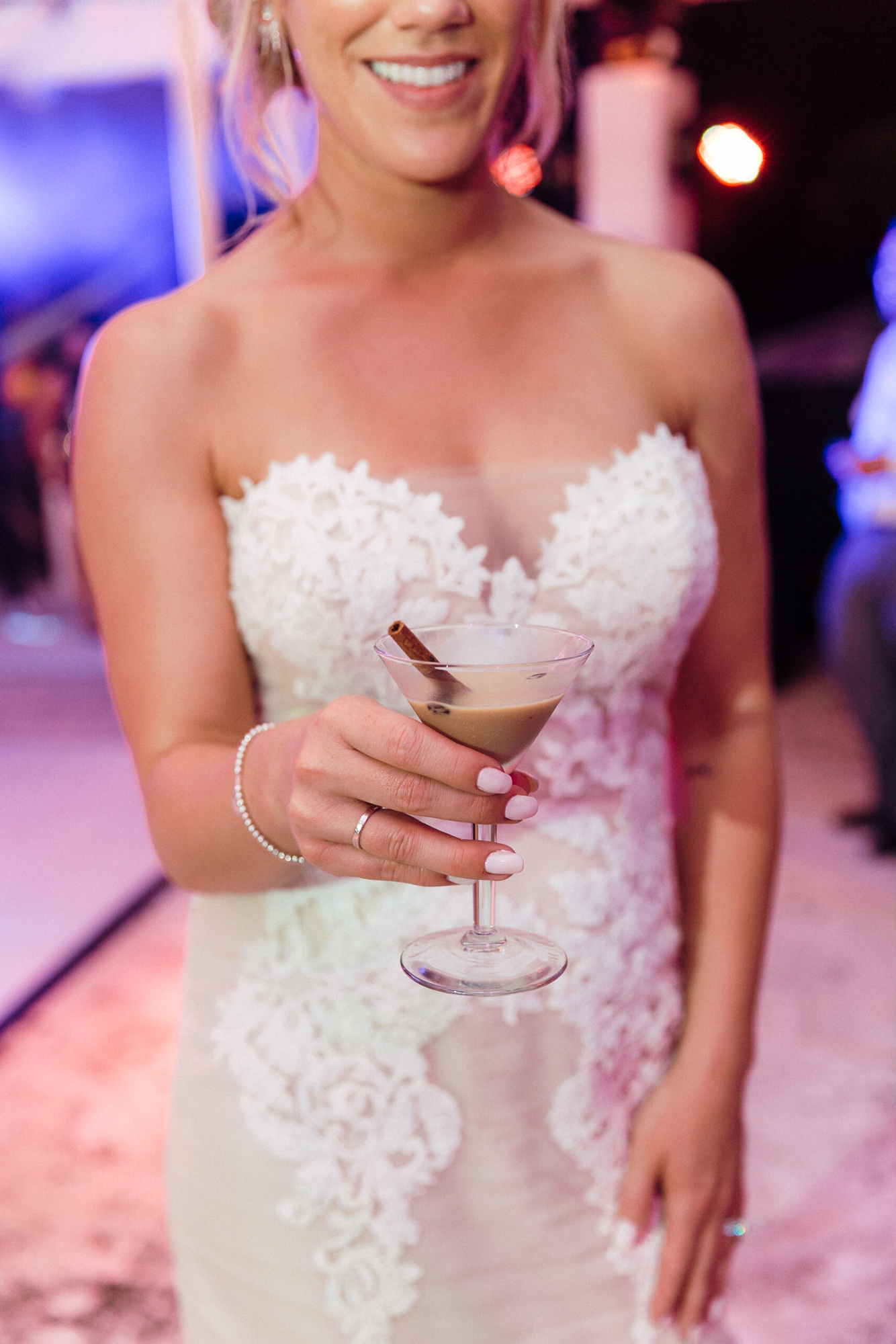 The martini bar opened up for guests on Fisher Island at this Florida wedding. Here's the bride holding the super yummy espresso martini!