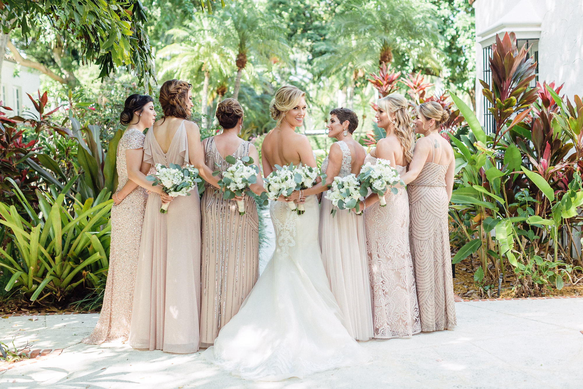 Mismatched bridesmaids dresses, champagne and blush, eucalyptus bouquet. Must have bride and bridesmaids photo