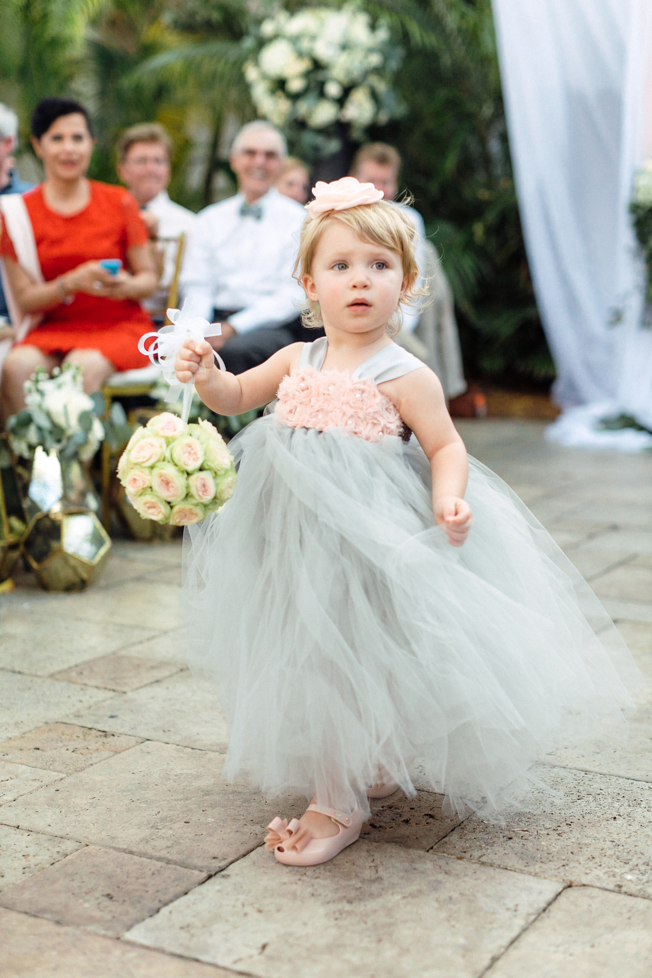 The cutest flower girl outfit featured tons of tulle in the wedding colors and a pomander ball