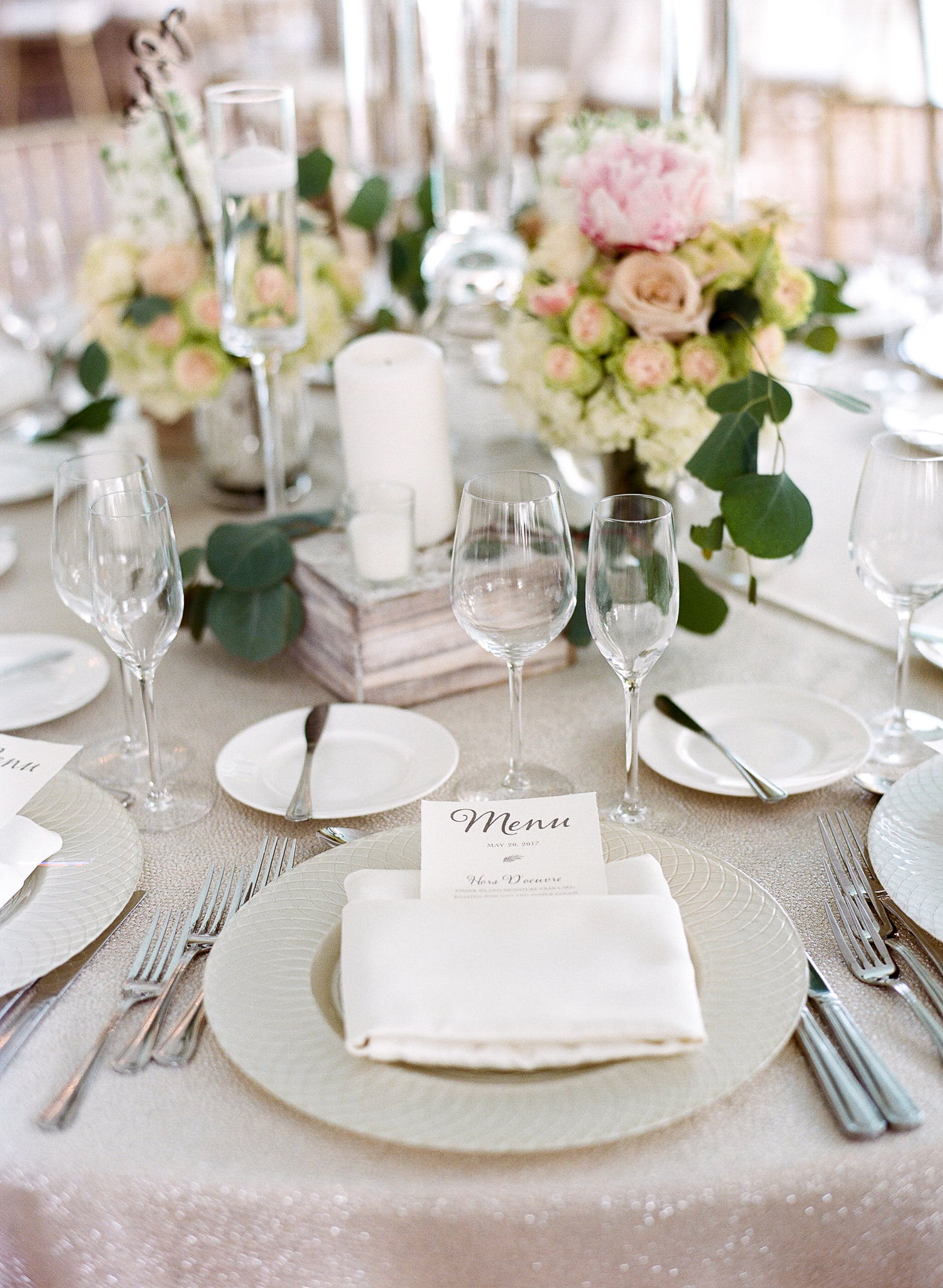 The centerpieces featured white washed wood boxes and lots of greenery