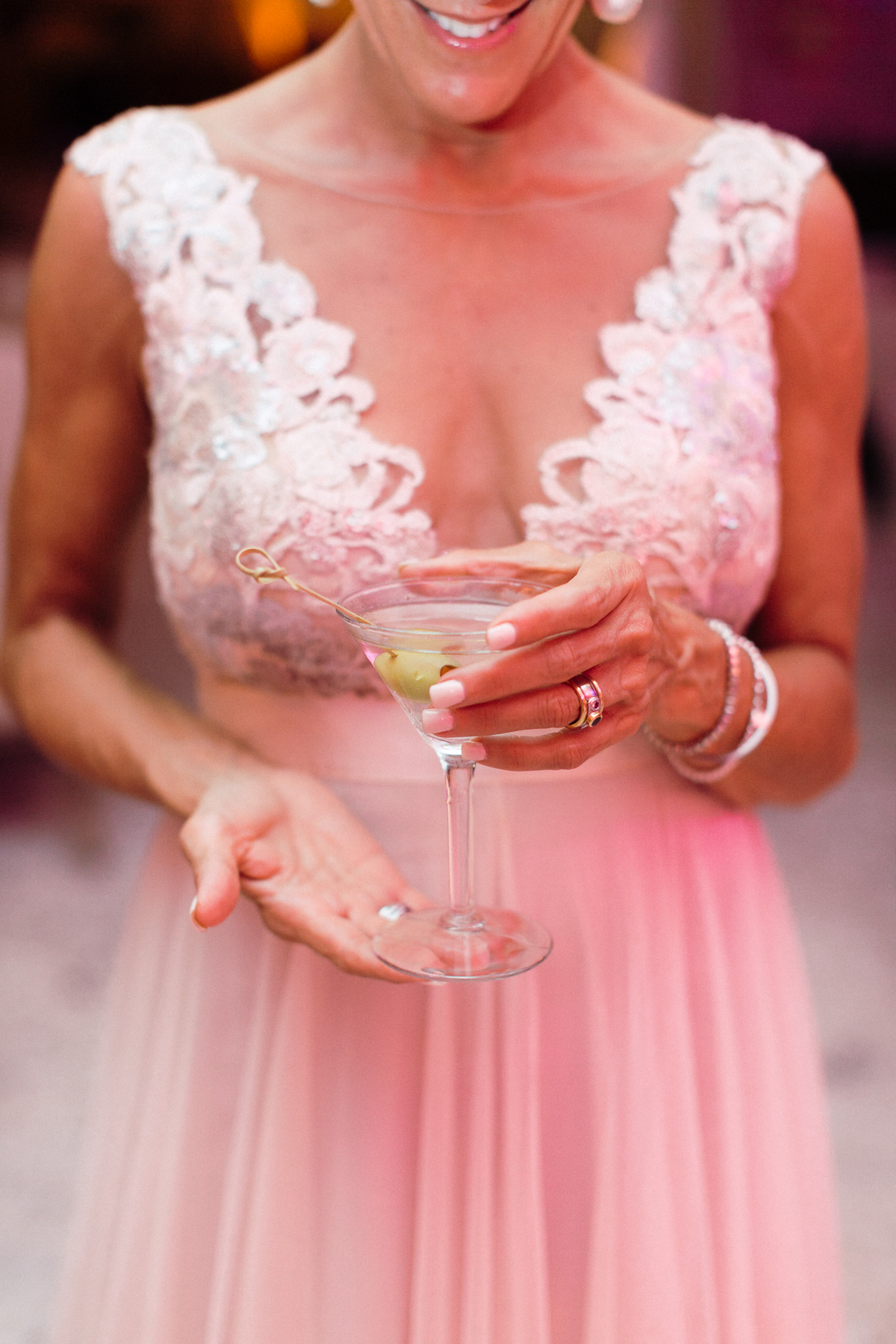 The maid of honor with her dirty martini from the martini bar