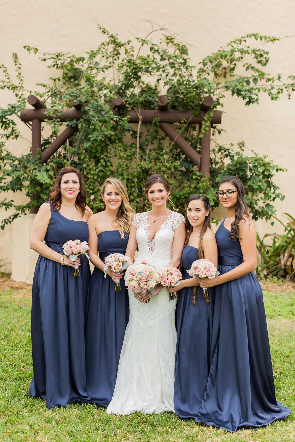 The bridesmaids wore long navy dresses