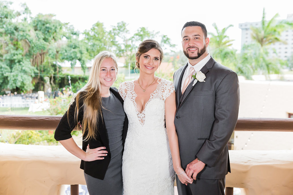 Oh My Occasions, your South Florida wedding planner posing with her bride and groom for this Curtiss Mansion wedding