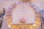 silver and gold charger plates with a vellum menu