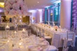 white and blush centerpieces with silver chiavari chairs in the four seasons Miami ballroom