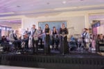 wedding band on a black skirted stage
