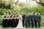 5 bridesmaids and 5 groomsmen stand next to the bride and groom at this villa woodbine wedding