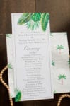 a long rectangular tropical wedding program features printed green leaves