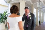the groom reacts to seeing his bride for the first time during first look by tearing up