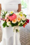 bridal bouquet with fuschia, magenta, purple, and ivory flowers