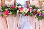 bouquets with fuschia, magenta, ivory, and greenery