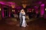 bride and groom kiss in the La Playa Naples ballroom
