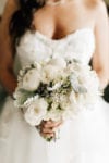 bride's flower bouquet of dusty miller, lambs ear, peonies, and roses