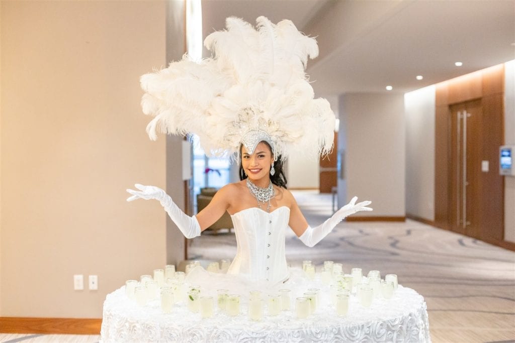 A strolling table at Conrad Ft. Lauderdale wedding displays welcome drinks