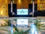 miami beach edition wedding with tropical palm leaf dance floor wrap and custom monogram DJ booth