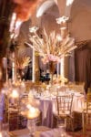 pampas grass, curly willow, rose, and candle centerpiece with gold chiavari chairs and blush linens