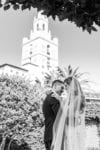 bride and groom kiss outside biltmore coral gables