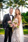 bride and groom at biltmore miami wedding with berta wedding gown and king protea bouquet