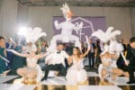 hora loca performers at jw marriott marquis miami wedding with gold and white checker board dance floor wrap