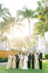 mandarin oriental miami wedding party with gold bridesmaids dresses, calla lily bouquets, orchid bouquets and groomsmen with tail tuxedos
