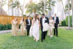 mandarin oriental miami wedding with gold dresses and white orchid bouquet
