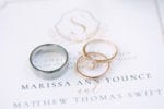 ring shots on wedding invitation with monogram