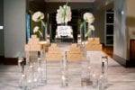 salty donut mirror pedestal display with white orchids