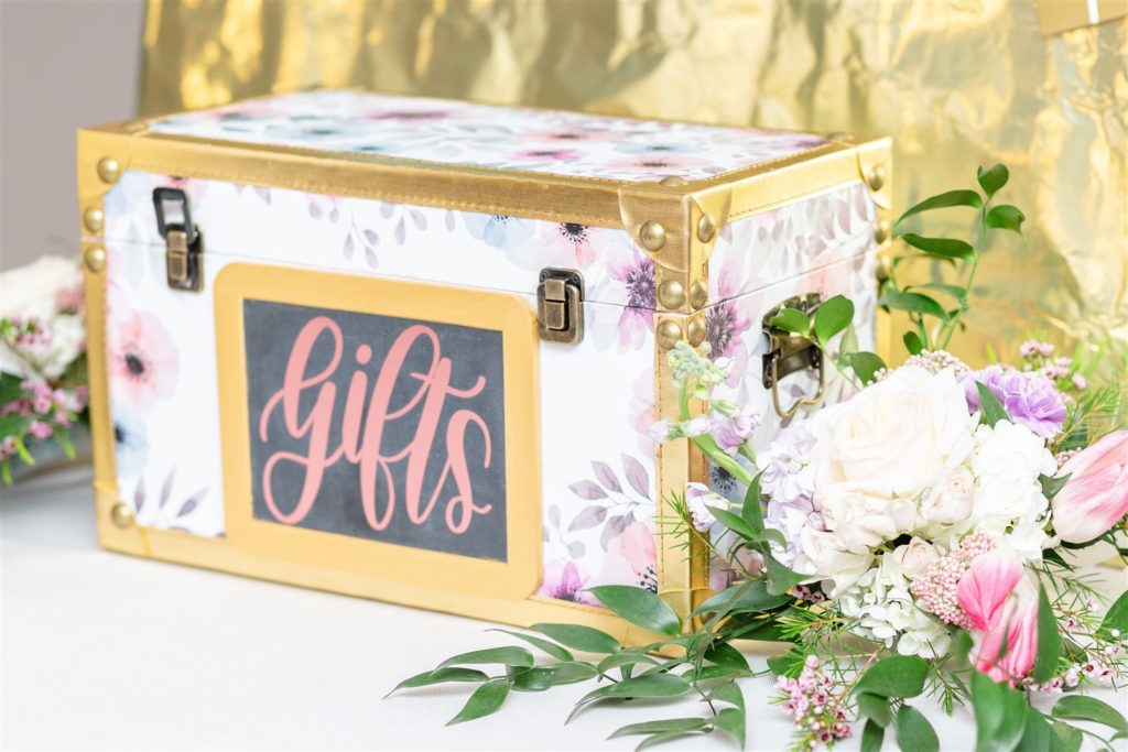 The money box decorated with florals and gold accents at The Conrad Fort Lauderdale Beach, wedding planned by Oh My Occasions