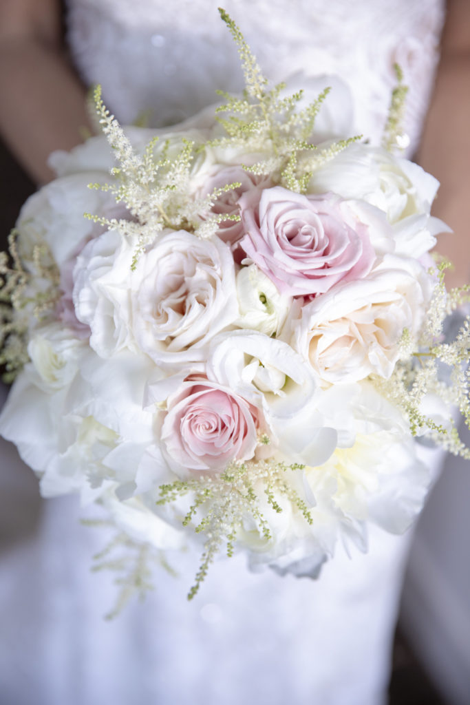 White and pink rose bouquet of flowers at the Kimpton EPIC Hotel, planned by Oh My Occasions