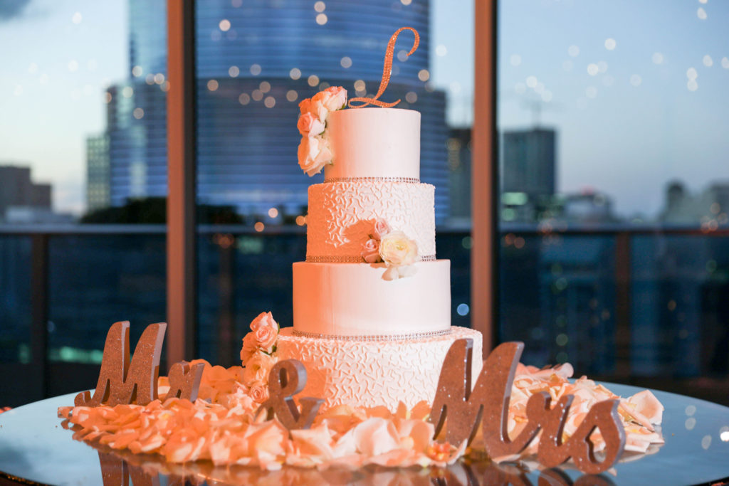 White four-layered bedazzled cake with ripple tears at the Kimpton EPIC Hotel, planned by Oh My Occasions