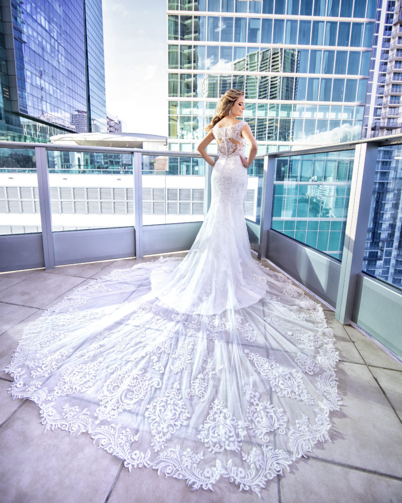 A beautiful wedding dress train worn by the bride at the Kimpton EPIC Hotel, planned by Oh My Occasions