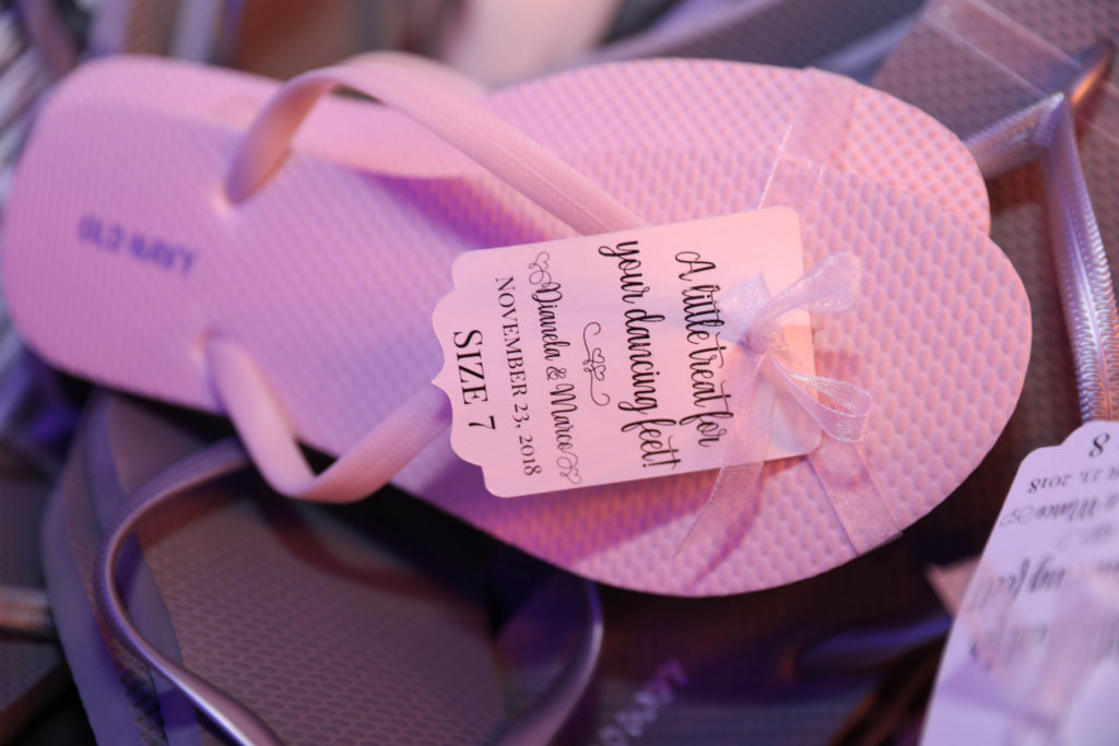 Baby pink flip flops for the guests on the dance floor at the Kimpton EPIC Hotel, planned by Oh My Occasions