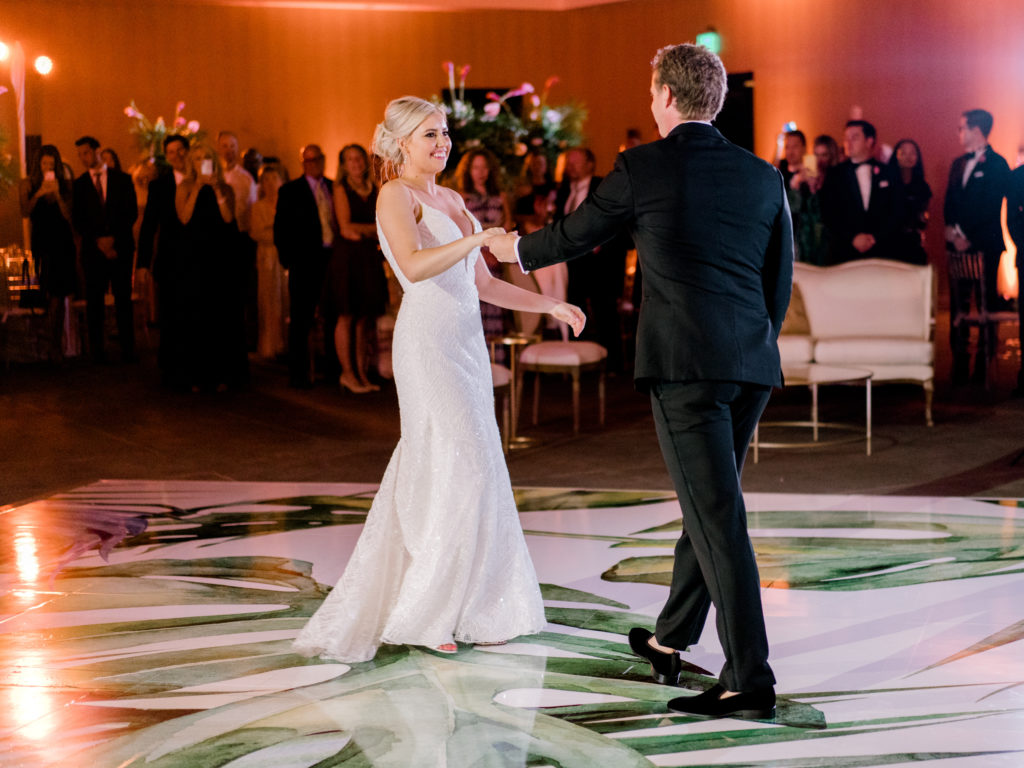 The bride and groom having their first dance at Miami Beach Edition, planned by Oh My Occasions