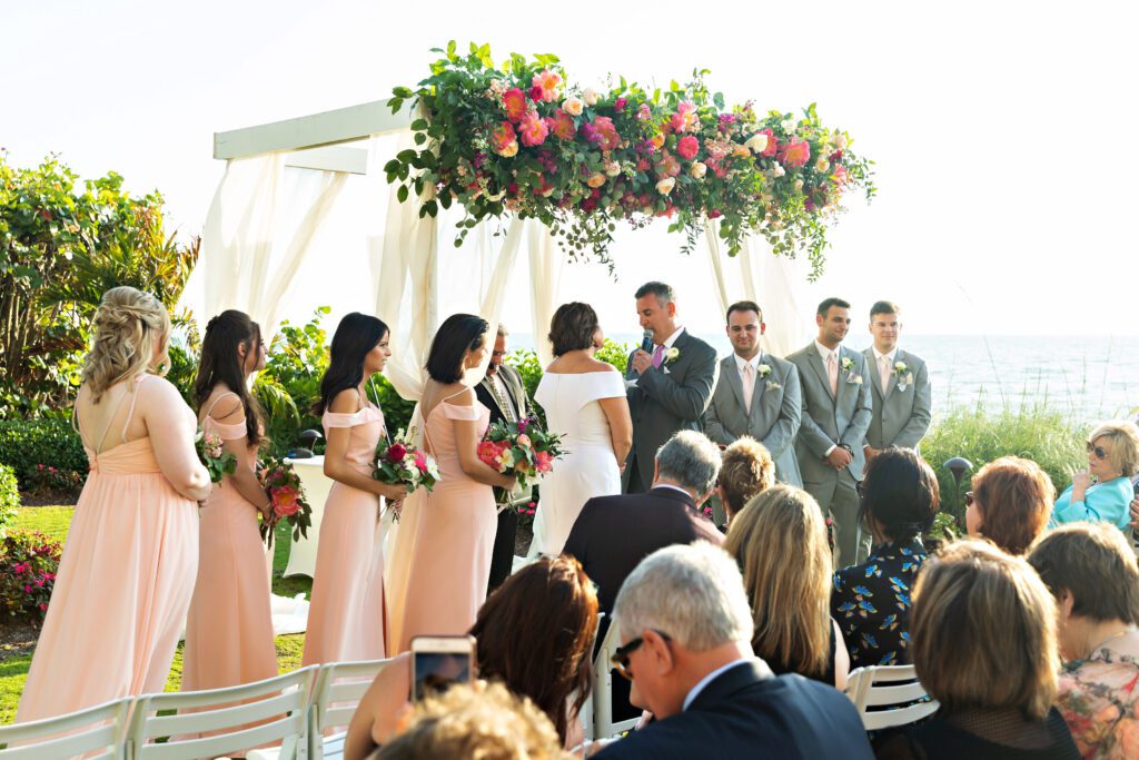 a gorgeous flower-covered chuppah for a wedding ceremony at La Playa Golf and Beach Resort in Naples Florida